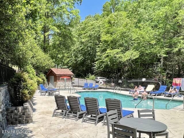 view of pool featuring a patio area