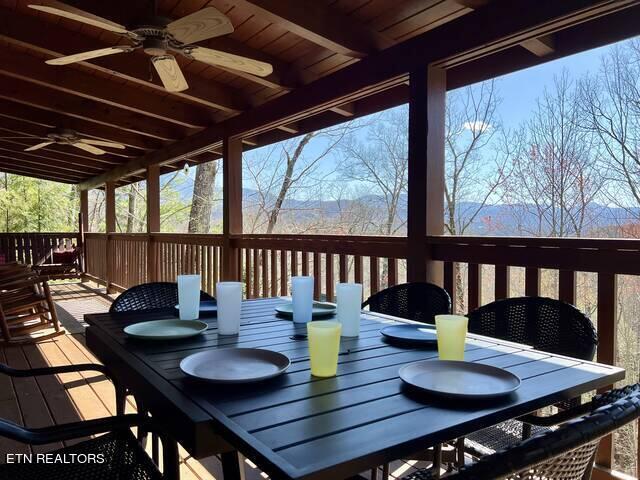 wooden deck with ceiling fan