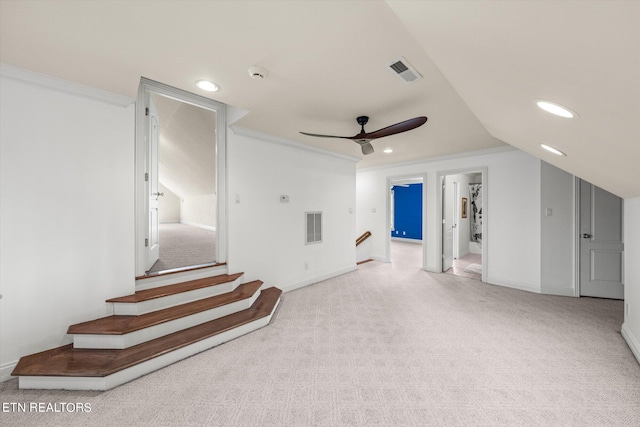 additional living space featuring lofted ceiling, light carpet, and ceiling fan