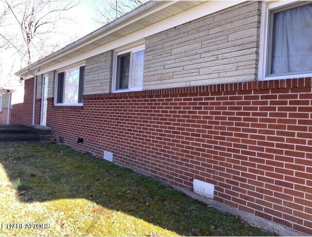 view of property exterior with a yard