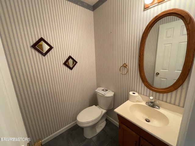 bathroom featuring vanity, toilet, and tile patterned floors