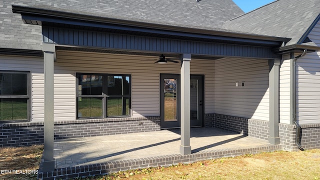 entrance to property featuring ceiling fan