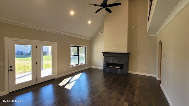 unfurnished living room with a tiled fireplace, ceiling fan, high vaulted ceiling, and dark hardwood / wood-style floors