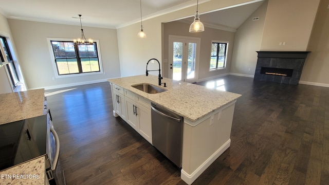 kitchen with white cabinetry, dishwasher, sink, decorative light fixtures, and a kitchen island with sink