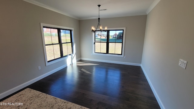 unfurnished dining area featuring a chandelier, dark hardwood / wood-style floors, and crown molding