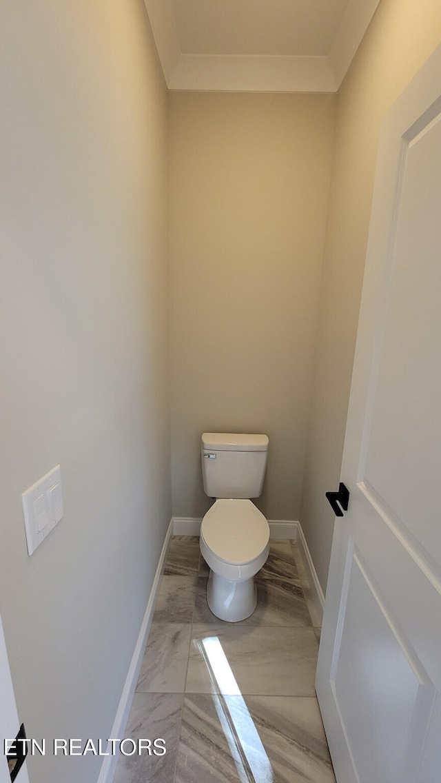 bathroom featuring toilet