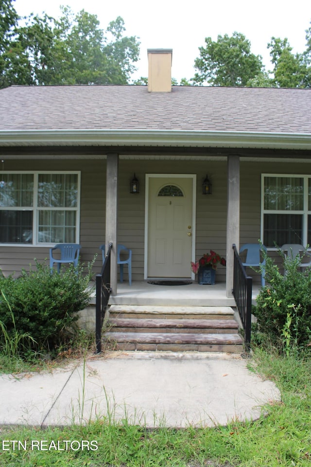 entrance to property with covered porch