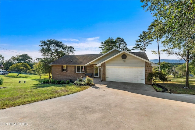 view of front facade featuring a garage and a front lawn