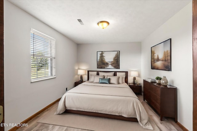 bedroom featuring light wood-type flooring