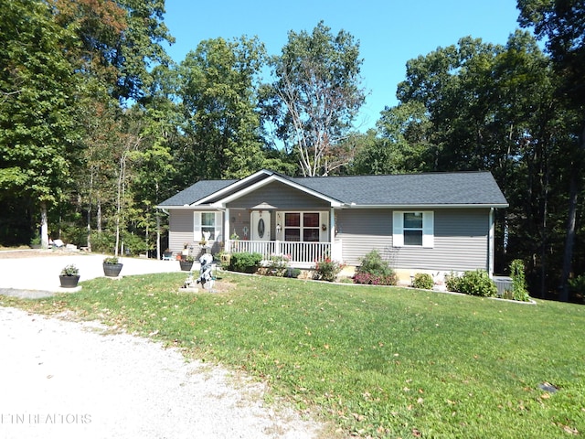 ranch-style home featuring a front yard and a porch