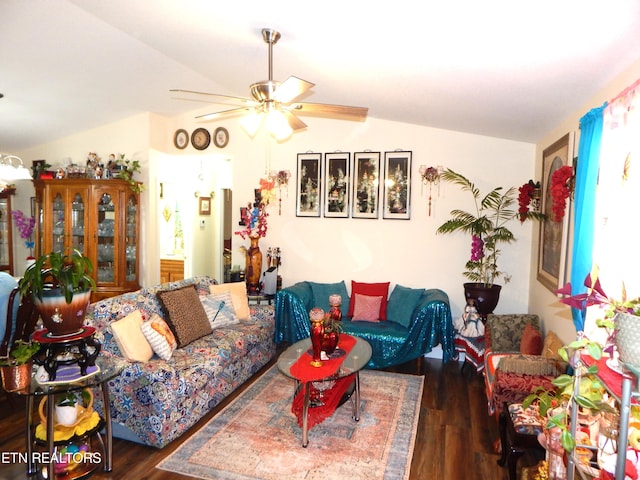 living room with vaulted ceiling, ceiling fan, and dark hardwood / wood-style floors