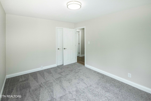 unfurnished room with carpet flooring