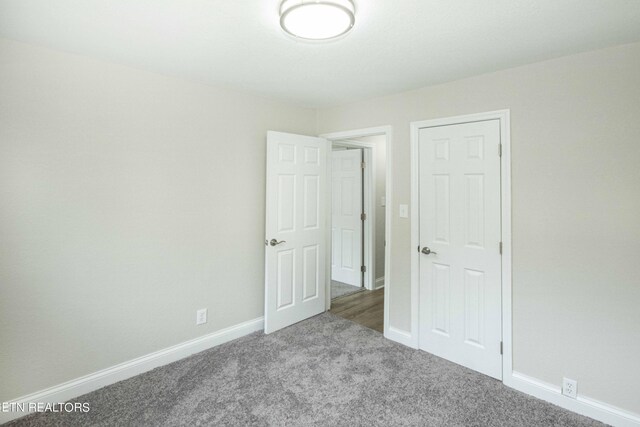 empty room featuring light carpet