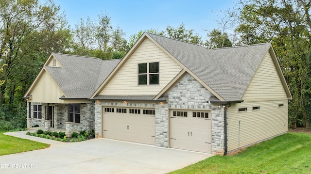 view of front of house with a front yard and a garage