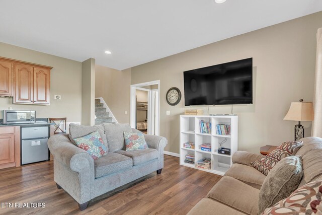 living room with dark hardwood / wood-style floors