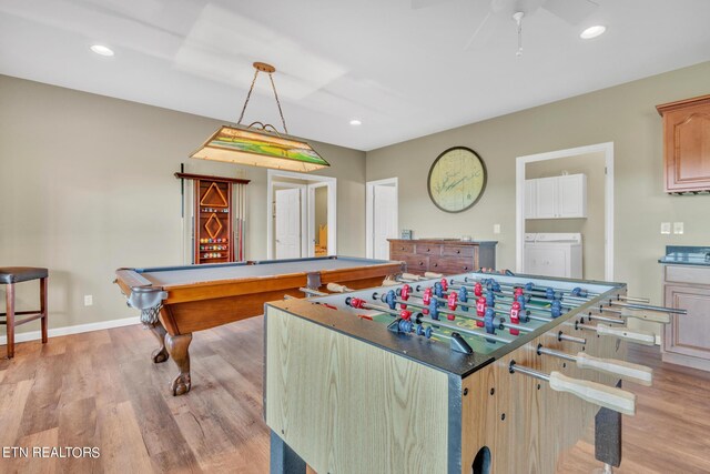 recreation room featuring washer and clothes dryer, light wood-type flooring, pool table, and ceiling fan