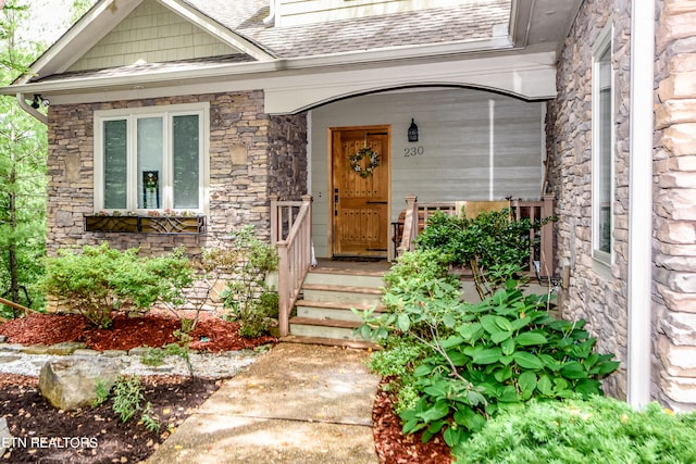 property entrance with covered porch