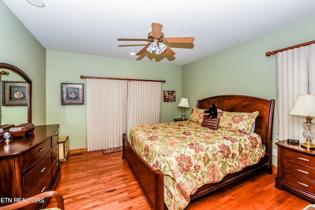 bedroom featuring ceiling fan and light hardwood / wood-style floors