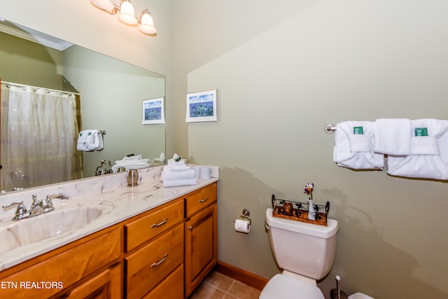 bathroom featuring vanity, toilet, walk in shower, and tile patterned flooring