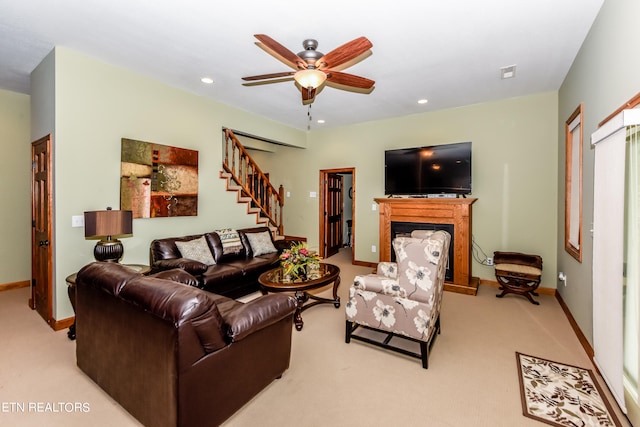 carpeted living room featuring ceiling fan