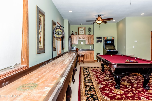 game room with ceiling fan, pool table, and bar