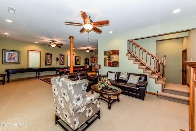 living room featuring ceiling fan and light colored carpet