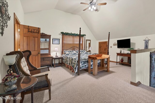 bedroom featuring lofted ceiling, ceiling fan, and light carpet