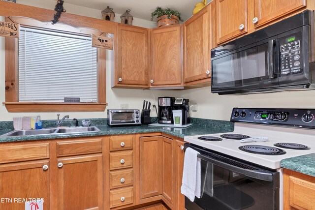 kitchen featuring sink and electric range