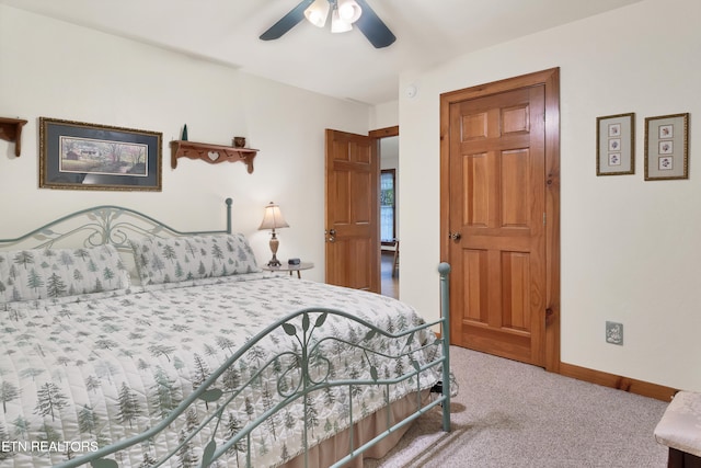 bedroom featuring ceiling fan and carpet