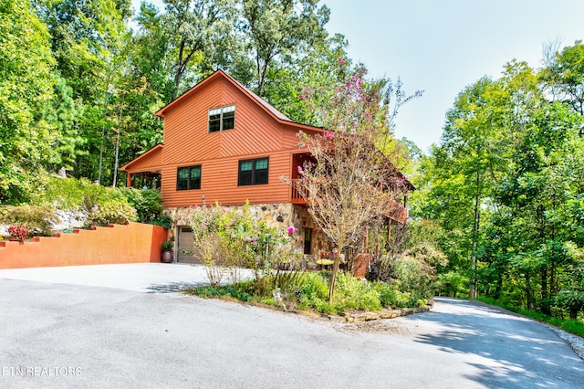 view of side of property with a garage