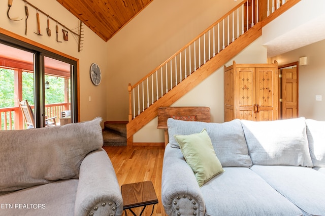 living room featuring high vaulted ceiling, wood-type flooring, and wooden ceiling