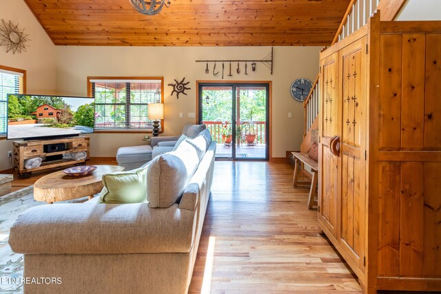 living room with wooden ceiling, lofted ceiling, light wood-type flooring, and a wealth of natural light