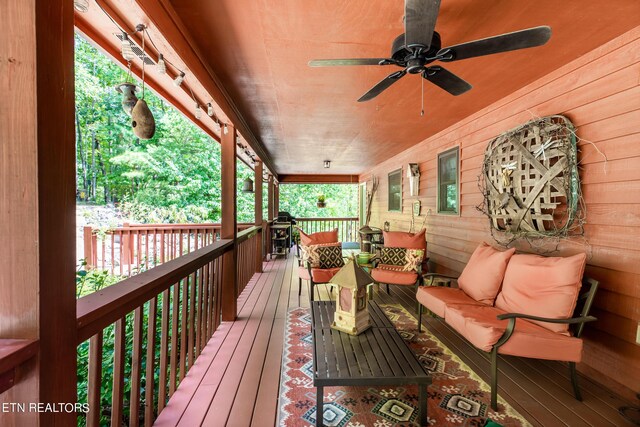 wooden deck featuring ceiling fan and an outdoor hangout area