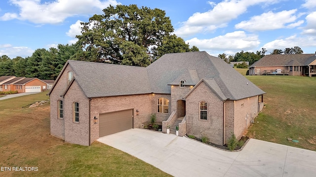 french country inspired facade with a front yard and a garage