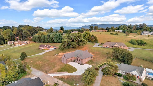 birds eye view of property with a mountain view