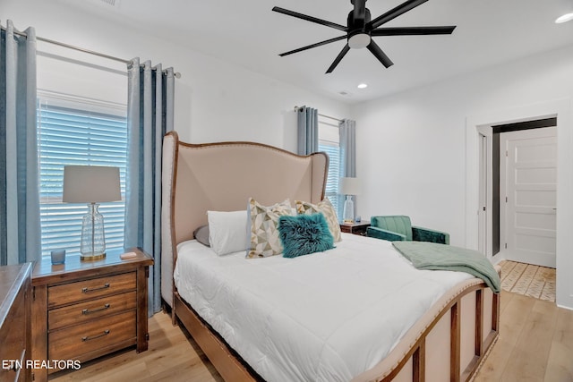 bedroom featuring ceiling fan and light wood-type flooring