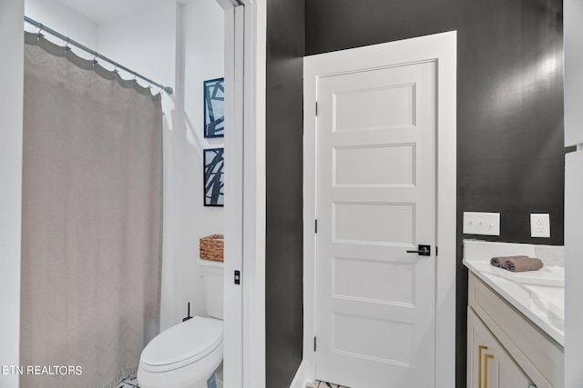 bathroom with vanity and toilet