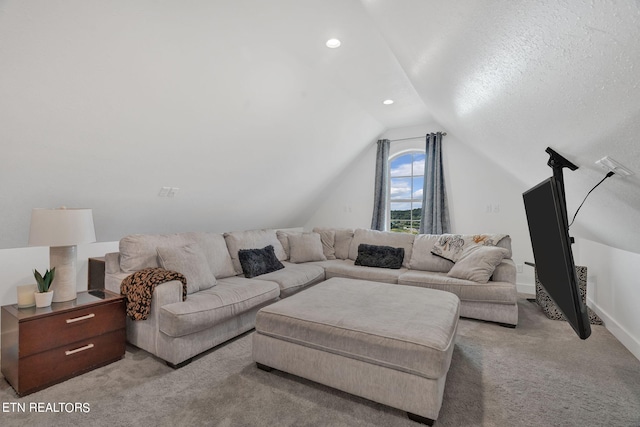 living room featuring light carpet, a textured ceiling, and vaulted ceiling