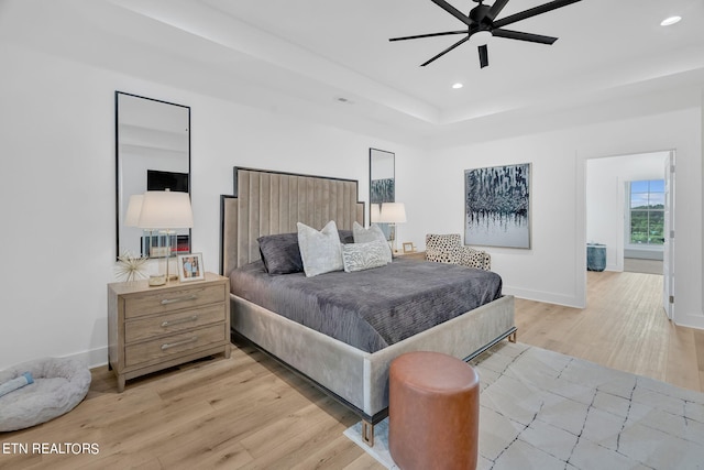 bedroom with light wood-type flooring and ceiling fan