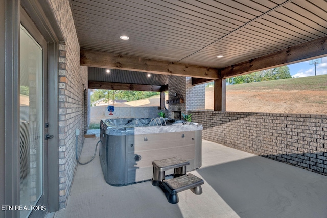 view of patio with a hot tub