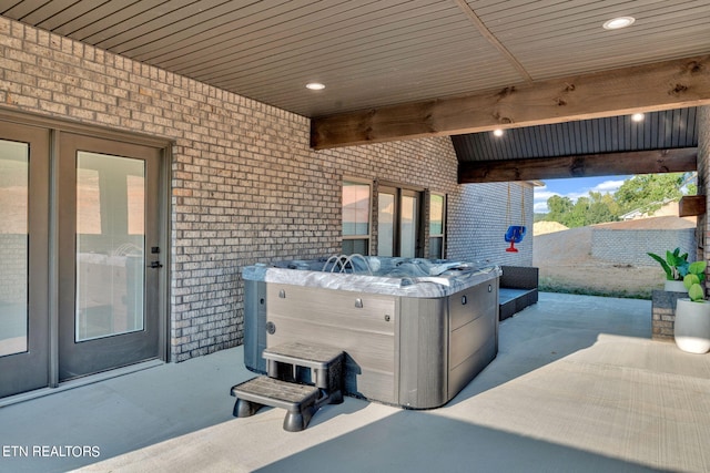 view of patio with a hot tub