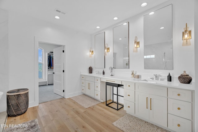 bathroom with wood-type flooring and vanity