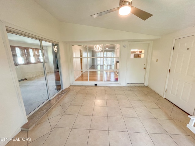 interior space with lofted ceiling, plenty of natural light, and ceiling fan