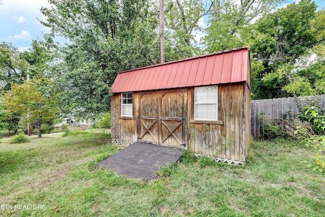 view of outdoor structure with a lawn