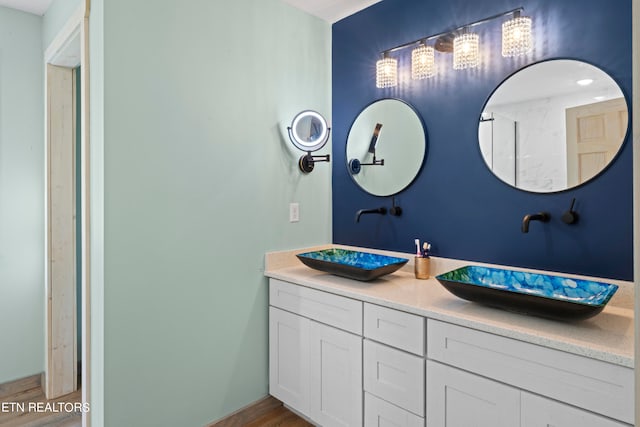 bathroom featuring vanity and hardwood / wood-style flooring