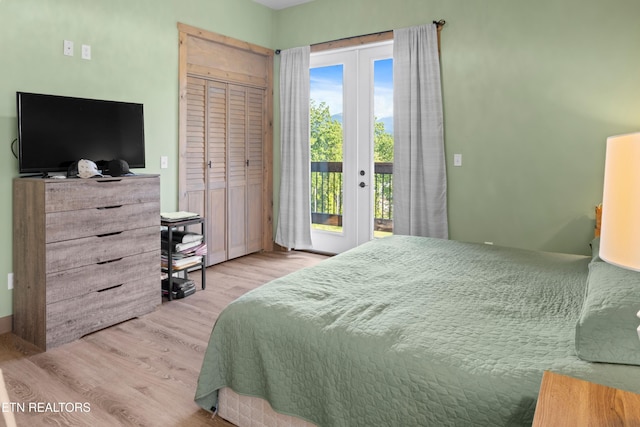 bedroom featuring light hardwood / wood-style flooring, a closet, access to exterior, and french doors