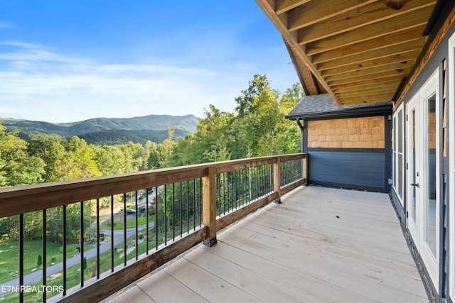 wooden deck featuring a mountain view