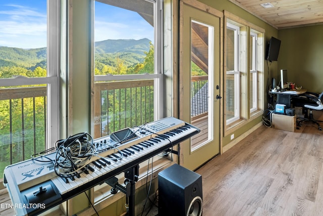 sunroom featuring wooden ceiling