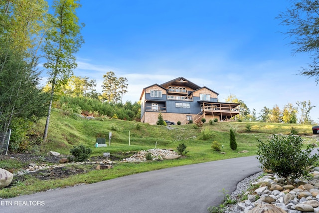 view of front of house with a wooden deck