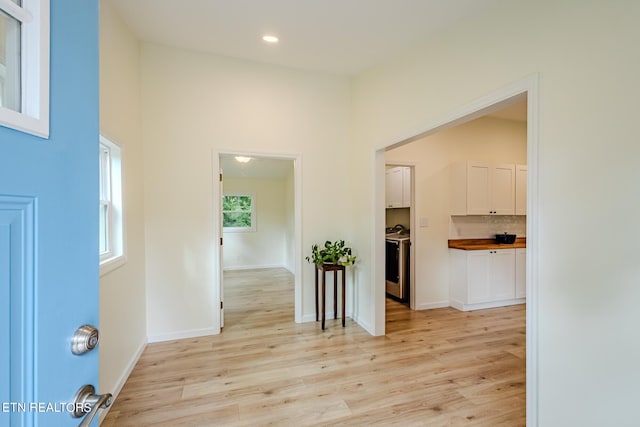 hallway with light wood-type flooring